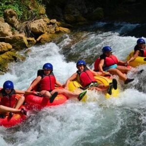 VibraGem Tours River Tubing Tour in Jamaica with a tourist family